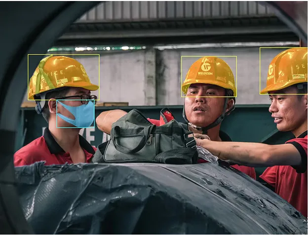 AI Detecting Hard Hats on Construction Workers AI system identifies workers wearing safety helmets and masks, showcasing how could compliance with PPE procedures be monitored effectively.
